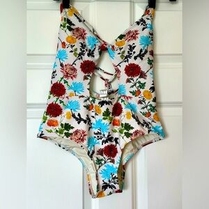 Kibys one-piece swimsuit size L made of smooth and elastic fabric with floral